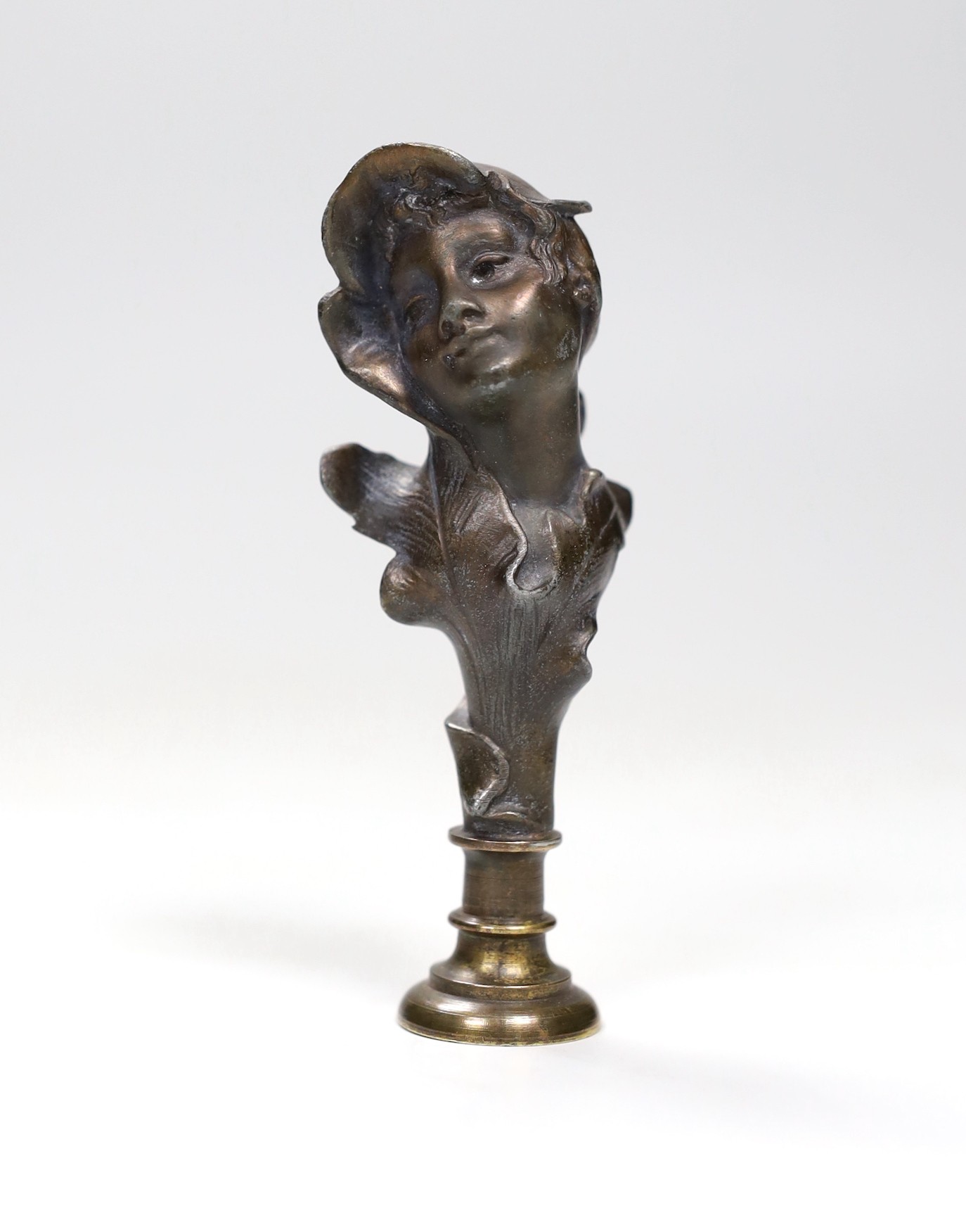 An Art Nouveau bust seal, signed Anglos, 10cm